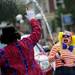 Members of the Backwards Clown Brigade have a little fun with their squirt guns as they walk in the 23rd Annual Ann Arbor Jaycees Fourth of July Parade on Thursday, July 4, 2013 on South State Street in downtown Ann Arbor. Melanie Maxwell | AnnArbor.com